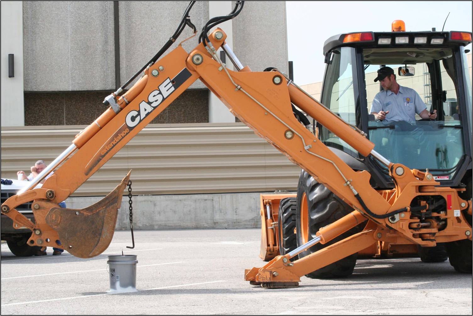 Town of Vinton employee Jason in the middle of some precise maneuvering in the Backhoe event.